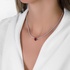 Tennis diamond necklace with a ruby heart