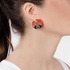 Fashionable art deco earrings with coral and black onyx