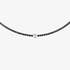 Black diamond tennis necklace with an oval cut diamond at the center