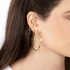 Large gold hoops with dangling diamond drops
