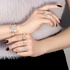 three-tone gold ring with diamonds