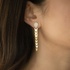 Fashionable long gold earrings