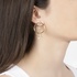 gold round earrings with dangling diamonds