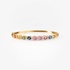 Gold bangle bracelet with colourful sapphires