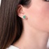 Oval emerald earrings with diamonds