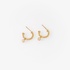 Gold ribbed hoops with a dangling diamond charm