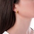 Single fashionable gold earring with yellow enamel