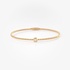 Sleek gold bangle bracelet with diamonds accents