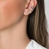 White gold earcuff with diamonds and an emerald