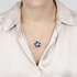 Gold flower pendant with lapis petals and diamonds