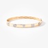 Gold bangle bracelet with different shapes made of diamonds