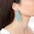 Fashionable long earrings with turquoise and enamel