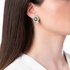 white gold earrings with emeralds