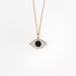 Gold evil eye pendant with black and white diamonds