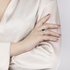 White gold big emerald rosette ring with diamonds
