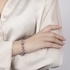 White gold flower bracelet with amethyst , tourmaline and rhodolite