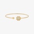 Pink gold bangle bracelet with a flower