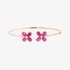 Thin gold bangle bracelet with two ruby flowers