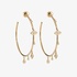 Large gold hoops with dangling diamond drops