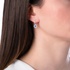 White gold diamond earrings with pending sapphire rosettes