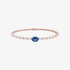 Pink gold bangle bracelet with diamonds and a sapphire