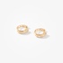 Tiny gold hoops with diamonds