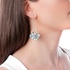flower shaped long earrings wiith aquamarines and diamonds