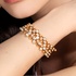 Gold bangle bracelet with brilliant diamonds on gold squares