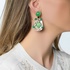Stylish long earrings in white and green colors