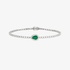 White gold tennis bracelet with pear cut emerald