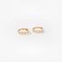 Tiny gold hoops with baguette diamonds