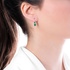 White gold earrings with emeralds
