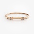 Pink gold bangle bracelet with diamonds