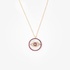 Gold round evil eye pendant with mother of pearl and rubies