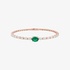 Gold bangle bracelet with diamonds and an emerald