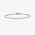 White gold tennis bracelet with a marquise diamond at the center