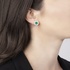Round emerald rosette earrings