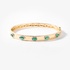 Gold bangle bracelet with emeralds and diamonds