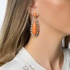 Long coral earrings with diamonds