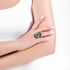 Stunning white gold ring with emeralds and diamonds