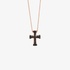 Small pink gold cross with black diamonds