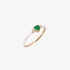 Gold ring with white enamel and a heart shaped emerald