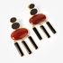 Fashionable silver earrings with onyx and amber