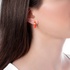 Single fashionable gold earring with orange  enamel