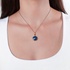 Monica Rich Kosann round locket with blue enamel and blue sapphire