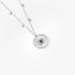 Round white gold pendant with mother of pearl and a heart cut sapphire