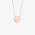 Pink gold round pendant with a heart