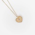 Gold heart shaped pendant with a diamond cross outline