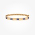 Gold bangle with tanzanites